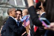 Image courtesy of the Barack Obama Presidential Library, President Barack Obama holds a baby as…