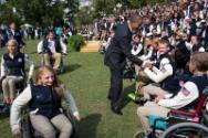 Image courtesy of the Barack Obama Presidential Library, President Barack Obama greets athletes…