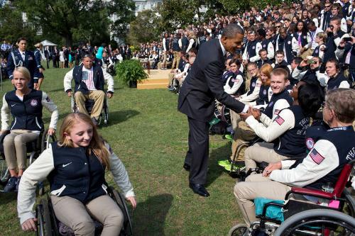 Image courtesy of the Barack Obama Presidential Library, President Barack Obama greets athletes…