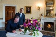 Image courtesy of the Barack Obama Presidential Library, President Barack Obama watches as Pres…
