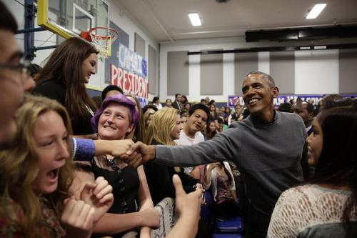 Image courtesy of the Barack Obama Presidential Library, President Barack Obama greets audience…