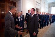 Image courtesy of the Barack Obama Presidential, President Barack Obama greets Coach Troy Calho…