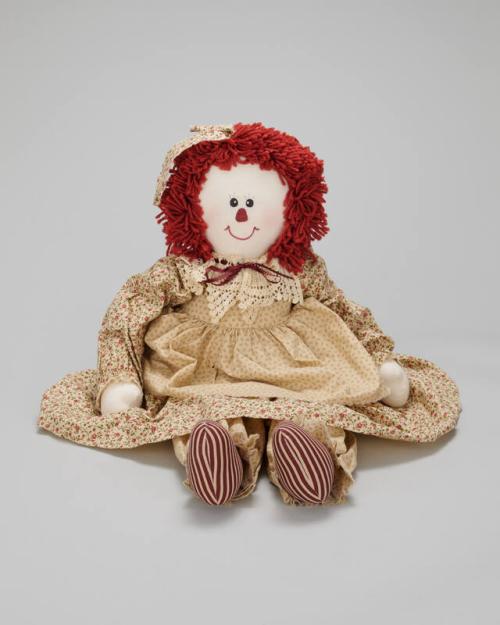 Rag Doll in a Cream, Green, and Red Dress