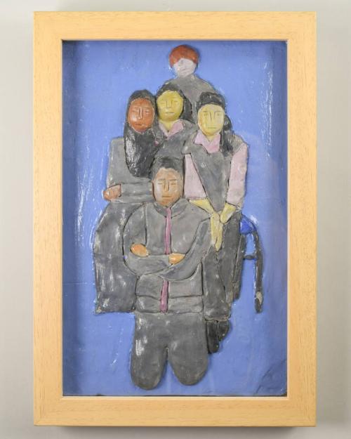 Clay Sculpture of People in Shadow Box