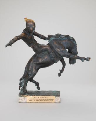 Sculpture of a Man Riding a Horse