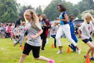Image courtesy of the Barack Obama Presidential Library, First Lady Michelle Obama runs at an a…