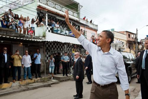 Image courtesy of the Barack Obama Presidential Library, President Barack Obama waves to people…