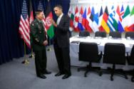 Image courtesy of the Barack Obama Presidential Library, President Barack Obama talks with Gen.…
