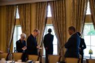 Image courtesy of the Barack Obama Presidential Library, President Barack Obama waits with advi…