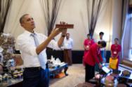 Image courtesy of the Barack Obama Presidential Library, President Barack Obama shops at a vend…