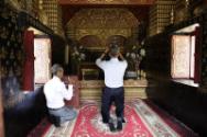 Image courtesy of the Barack Obama Presidential Library, President Barack Obama lifts a Buddha …